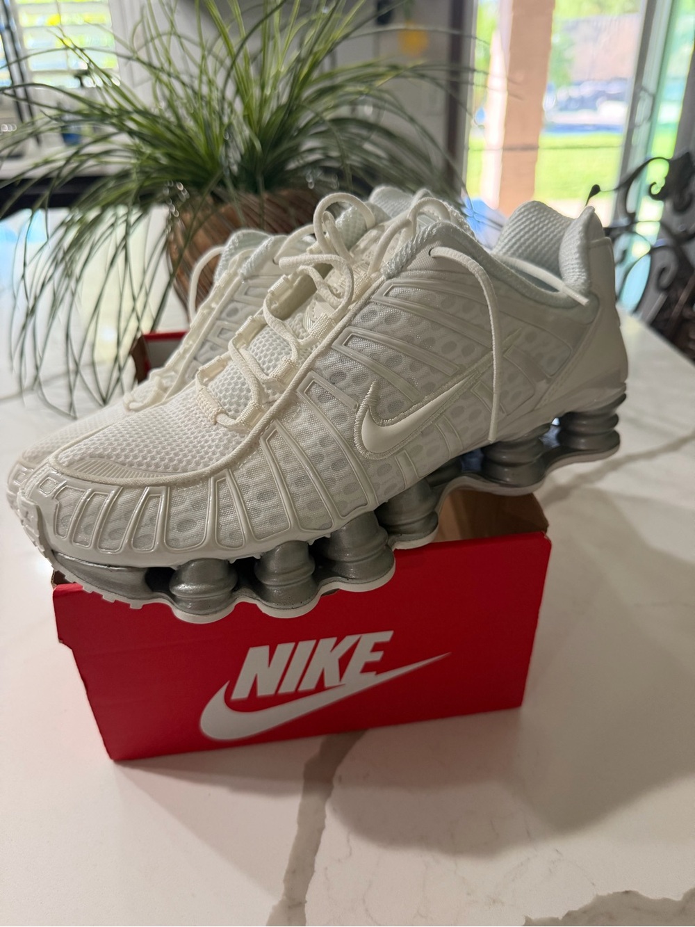 Nike women’s White and Silver Shox Athletic Sneakers